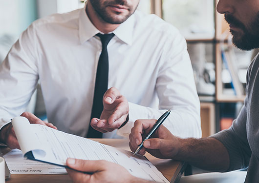 Employee reviewing a contract with small business insurance in Bossier City